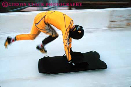 Stock Photo #6367: keywords - action aerodynamic aerodynamics alone blur chill chilly chute cold course danger dangerous downhill fast gravity horz ice icy injury luge motion movement moving park push race racer racing risk slide slider sliding slip slippery solo speed sport sports start suit track utah winter yellow