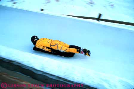 Stock Photo #6368: keywords -  action aerodynamic aerodynamics alone chill chilly chute cold course danger dangerous downhill fast glide glider gliding gravity horz ice icy injury luge motion park race racer racing risk slide slider sliding slip slippery solo speed sport sports suit track utah winter yellow