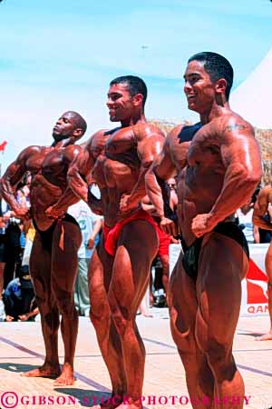 Stock Photo #6369: keywords -  african american bathing beach black bodies body builder builders building built bulge compete competing competition competitor condition conditioning contest contestant display displaying displays ethnic fit fitness flex flexes flexing flexion florida large macho male man men miami minority muscle muscles muscular outdoor outdoors outside perform performance performers physical physically pose posed posing present sex sexual sexy shape show showing showoff skimpy skin strong suit summer tan training vert weight