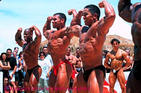 Stock Photo #6371: keywords -  african american bathing beach black bodies body builder builders building built bulge compete competing competition competitor condition conditioning contest contestant display displaying displays ethnic fit fitness flex flexes flexing flexion florida horz large macho male man men miami minority muscle muscles muscular outdoor outdoors outside perform performance performers physical physically pose posed posing sex sexual sexy shape show showing showoff skimpy skin strong suit summer tan training weight