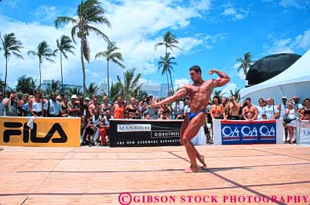 Stock Photo #6372: keywords - bathing beach bodies body builder builders building built bulge compete competing competition competitor condition conditioning contest contestant display displaying displays fit fitness flex flexes flexing flexion florida horz large macho male man men miami muscle muscles muscular outdoor outdoors outside perform performance performers physical physically pose posed posing sex sexual sexy shape show showing showoff skimpy skin strong suit summer tan training weight
