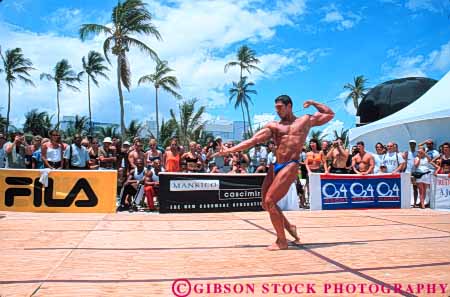 Stock Photo #6372: keywords -  bathing beach bodies body builder builders building built bulge compete competing competition competitor condition conditioning contest contestant display displaying displays fit fitness flex flexes flexing flexion florida horz large macho male man men miami muscle muscles muscular outdoor outdoors outside perform performance performers physical physically pose posed posing sex sexual sexy shape show showing showoff skimpy skin strong suit summer tan training weight