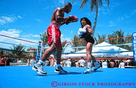 Stock Photo #6373: keywords -  african american beach boxer boxing combat contest couple ethnic female fight fist fl florida game gender glove hit horz learn male man match miami minority mixed outdoor outdoors outside pair play practice punch race racial ring sparing sport student summer teach teachers two warm woman