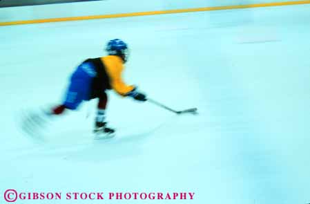 Stock Photo #6374: keywords -  adolescent blur boy boys child children chilly cold dynamic game hockey horz ice indoor motion move movement moving player puck recreation rink skate skater skating sport stick uniform winter youth