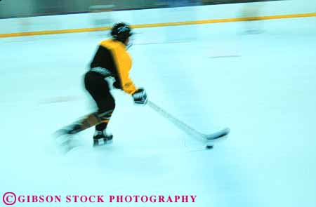 Stock Photo #6375: keywords -  adolescent blur boy boys child children chilly cold dynamic game hockey horz ice indoor motion move movement moving player puck recreation rink skate skater skating sport stick uniform winter youth