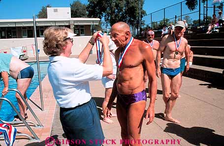 Stock Photo #13480: keywords -  achieve achieved achievement achieving active activity aged aging athlete athletes athletic athletics award awarding awards california challenge challenging champion champions citizen citizens commitment compete competing competition competitor competitors condition conditioning contest contestants contests coordination demanding determination effort elderly endurance exercise exercising exertion field fit fitness games horz longevity man mature old olympics people performance physical physically proud race racer racers races racing recreation redding ribbon ribbons senior seniors sports strength strenuous swim swimmer swimmers swimming swims track training win winner winning wins woman