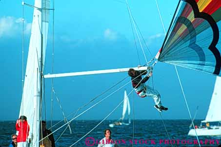 Stock Photo #10796: keywords -  bay boat boating boats california caution crew danger dangerous elevate elevated fix francisco gear hoisted horz lift lifted member recreation repair repairing repairs risk risky sail sailboat sailboats sailing san sport task up water work