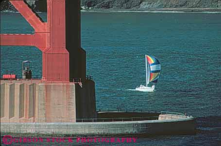 Stock Photo #10800: keywords - boat boating boats bridge california contrast contrasting contrasts difference different francisco gate golden horz passes recreation sail sailboat sailboats sailing san scale size small sport under
