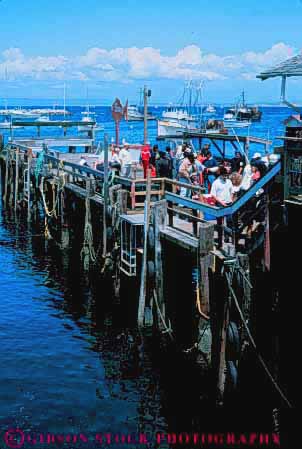 Stock Photo #10868: keywords -  attraction california coast coastal destination dock docks fishermens monterey ocean people sea seashore shore shoreline summer tourist travel travelers vert water wharf wharfs