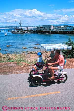 Stock Photo #10887: keywords -  attraction bike california coast coastal destination families family fun monterey motion play playing pleasure recreation rent rental rents seashore shore shoreline tourist travel vert