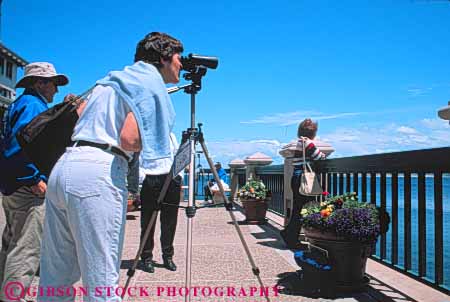 Stock Photo #10889: keywords -  attraction bird california coast coastal destination fun horz look looking monterey observe observer observing play playing pleasure recreation scope seashore see seeing shore shoreline spotting study telescope tourist travel vision watch watching