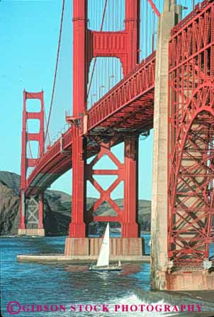 Stock Photo #10489: keywords -  bay boat boats bridge bridges cable california engineer engineered engineering famous francisco gate golden landmark landmarks marin metal red sail sailboat sailboats sailing san span spans steel suspension tall tower towers under underneath vert water