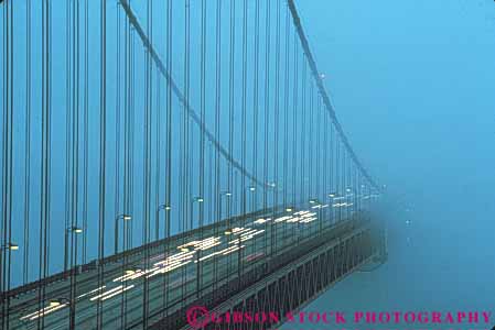 Stock Photo #10499: keywords -  bay bridge bridges cable california car cars cloud clouds condensation condense dew dusk engineer engineered engineering famous fog francisco gate golden headlights horz in landmark landmarks lighting lights metal moisture point red san span spans steel streak streaks suspension tall tower towers traffic vapor water weather