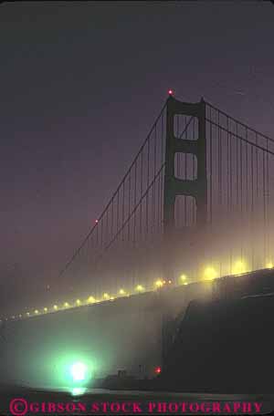 Stock Photo #10500: keywords -  bay bridge bridges cable california cloud clouds condensation condense dark dew dusk engineer engineered engineering evening famous fog francisco gate golden in landmark landmarks lighting lights metal moisture mood moody point red san span spans steel suspension tall tower towers vapor vert water weather