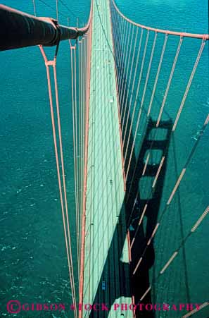Stock Photo #10506: keywords -  bay bridge bridges cable california deck elevated engineer engineered engineering famous francisco gate golden landmark landmarks metal red san span spans steel suspension tall tower towers vert view water