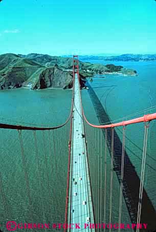 Stock Photo #10507: keywords - bay bilateral bilaterally bridge bridges cable california elevated engineer engineered engineering famous francisco gate golden landmark landmarks marin metal red san span spans steel suspension symmetrical symmetry tall towards tower towers vert view water