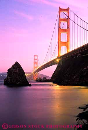 Stock Photo #10510: keywords -  bay bridge bridges cable california dark dusk engineer engineered engineering evening famous francisco gate golden landmark landmarks lighting metal red san span spans steel sunset sunsets suspension tall tower towers vert water
