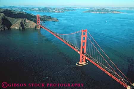 Stock Photo #10517: keywords -  aerial aerials bay bridge bridges cable california engineer engineered engineering famous francisco gate geometric geometrical geometry golden horz landmark landmarks metal red san span spans steel suspension tall tower towers water