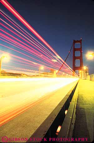 Stock Photo #10522: keywords -  abstract abstraction abstracts blur blurred bridge bridges bright california dark dusk evening famous francisco gate golden headlight landmark landmarks lights linear metal movement moving night san span spans steel streaks suspension taillight tall tower towers traffic vert