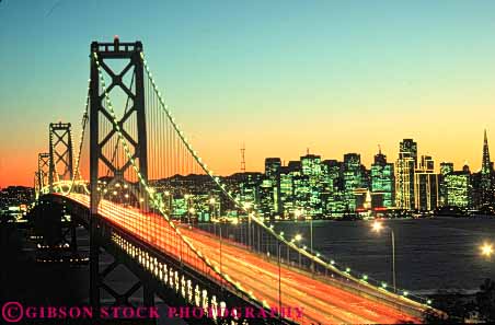 Stock Photo #10575: keywords -  bay blur blurred blurs bridge bridges bright california cities city cityscape cityscapes connect connected connects dark dusk engineer engineered engineering evening francisco headlight highway highways horz landmark landmarks light lighting lights metal night orange road roads san skyline skylines span spans steel streak streaks street streets sunset sunsets support supports suspend suspended suspension tail tall tower towers traffic urban warm