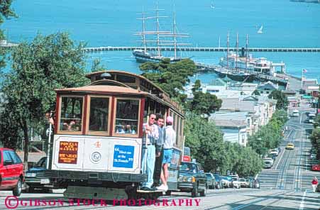 Stock Photo #10593: keywords -  attraction cable california car cars cities city francisco hills horz landmark landmarks moving municipal passenger passengers powell public ride riders riding san street tourist transport transportation transporting up uphill