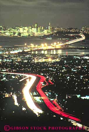 Stock Photo #10651: keywords -  blur blurred california center cityscape cityscapes dark district evening francisco highway lighting lights motion move movement moving night oakland san seen streak streaks tail traffic transportation urban vert