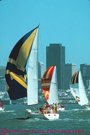 Stock Photo #10655: keywords -  aerodynamic aerodynamics air bay boating california crew driven effect effects float floating floats francisco glide glides gliding hull hulls people push pushing recreation sail sailboat sailboats sailing san sport sports team vert water wind