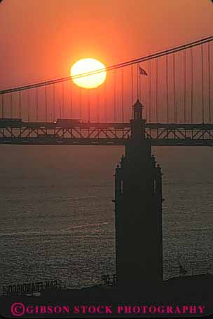 Stock Photo #10688: keywords -  architecture bay bridge building buildings california dark dawn design ferry francisco landmark landmarks morning orange san silhouette silhouettes style sunrise tall tower tradition traditional vert