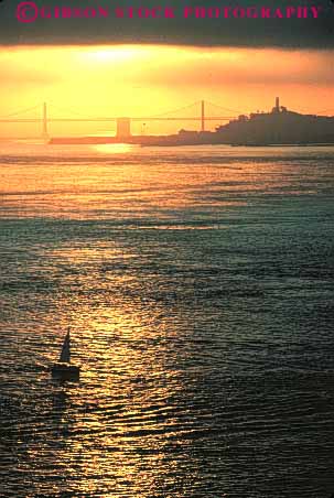 Stock Photo #10727: keywords -  bay boat boats california dawn francisco golden mood moody morning orange sail sailboat sailing san silhouette silhouettes sunrise sunrises sunset vert water yacht yachts