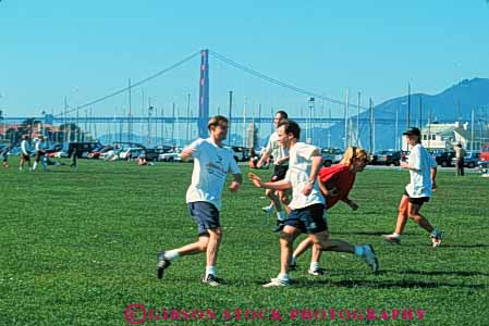 Stock Photo #10738: keywords - california football francisco fun game games gender grass green horz lawn marina mixed outdoor outside play recreation relax relaxing run runner runners running san summer team teams touch