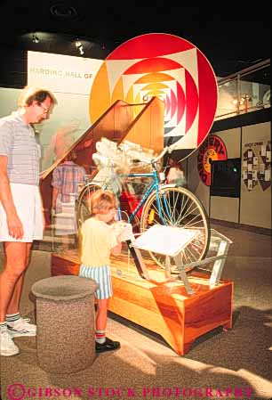 Stock Photo #9414: keywords -  balboa bicycle boy california center child city diego display father hydraulic interactive learn learning machine mechanics municipal park parks public san science son test uses vert