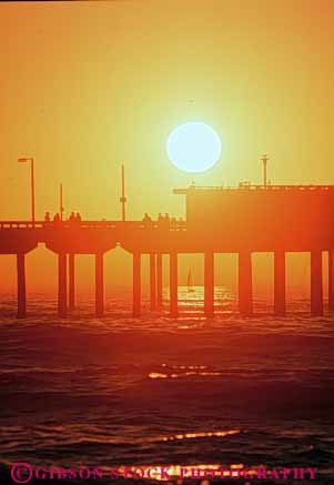 Stock Photo #9439: keywords - beach beaches california cement coast coastal concrete diego dock docks engineer engineered engineering leg legs ocean orange pier piers pile piling pilings platform san sea seashore shore shoreline silhouette silhouettes sunset support supported supports vert water