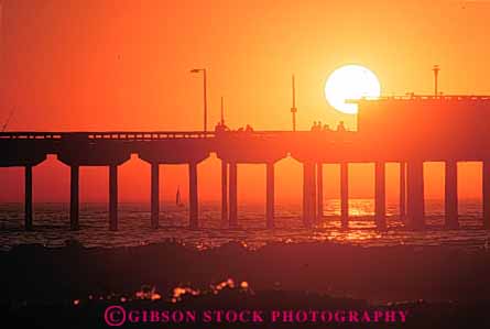 Stock Photo #9440: keywords - beach beaches california cement coast coastal concrete diego dock docks engineer engineered engineering horz leg legs ocean orange pier piers pile piling pilings platform san sea seashore shore shoreline silhouette silhouettes sunset support supported supports water