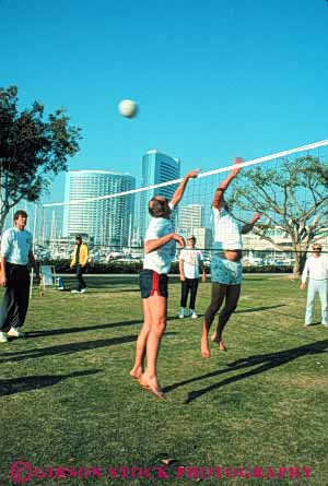 Stock Photo #9465: keywords -  ball bounce california cities city diego game hit jump jumping jumps lift mens net push reach reaching recreation san sport sports team vert volleyball