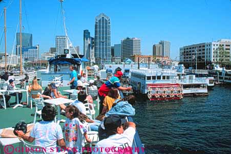 Stock Photo #9472: keywords -  boat boats california cities city cityscape diego downtown harbor horz people ride riders riding san see sight skyline summer tour tourist tourists tours travel vacation