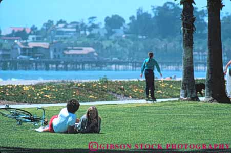 Stock Photo #9873: keywords -  along barbara beach beaches california coast coastal couple grass horz lawn marine maritime ocean people relax relaxed relaxing santa sea seashore shore