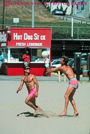 Stock Photo #9829: keywords -  beach beaches california coast coastal exercise exercising fitness man men monica play sand sandy santa seashore shore shoreline sport sports surf team two vert volleyball