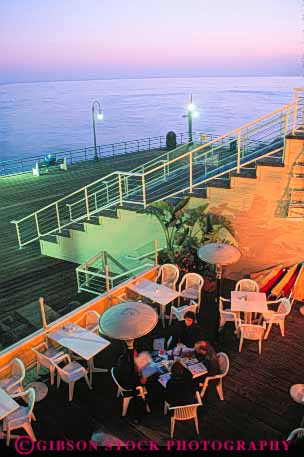 Stock Photo #9833: keywords - beach beaches cafe cafes california coast coastal dark dine dining dusk evening lighting lights monica night ocean outdoor outside people pier restaurant sand sandy santa sea seashore shore shoreline summer sunset sunsets surf vert warm water