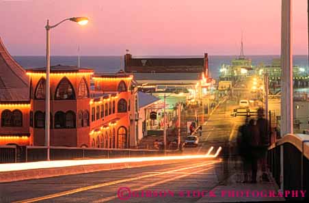 Stock Photo #9834: keywords -  auto autos beach beaches california car cars coast coastal dark dusk evening horz lighting lights monica motion movement night ocean onto pier piers sand sandy santa sea seashore shore shoreline streak streaks sunset surf traffic water