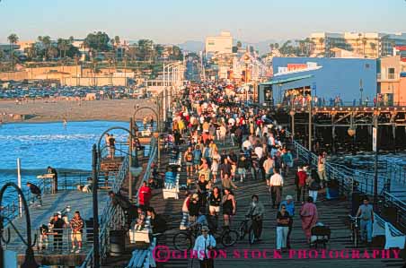 Stock Photo #9836: keywords - beach beaches california coast coastal crowd crowded dusk horz lots many monica multitude ocean people pier piers sand sandy santa sea seashore shore shoreline summer surf water