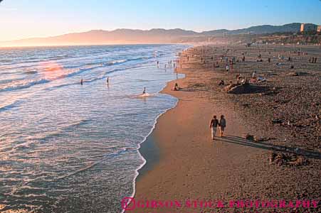 Stock Photo #9843: keywords -  beach beaches california coast coastal dark dusk evening horz monica night ocean people sand sandy santa sea seashore shore shoreline sunset surf water wave waves