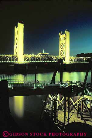 Stock Photo #11401: keywords - bridge bridges california cities city dark dusk evening illuminate lighting lights night over river sacramento tower vert