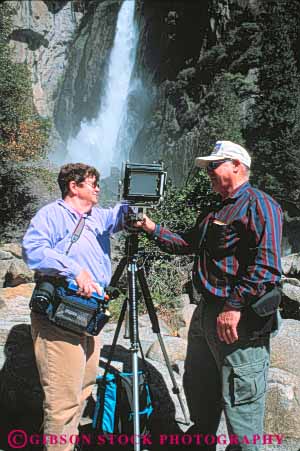 Stock Photo #9955: keywords -  alpine art artist california camera cameras cliff cliffs couple environment falls glaciers granite job landscape man mountain mountains mt mtn mtns national nature park parks photographer photographers photography recreation scenery scenic sierra skill summer use valley valleys vert view wild wilderness woman yosemite