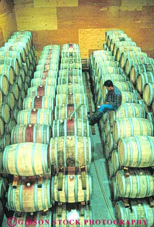 Stock Photo #10045: keywords -  aging barrel barrels california cellar cellars employee fills interior job jobs napa occupation stack stacked sterling valley vert wine wineries winery wines work worker workers working