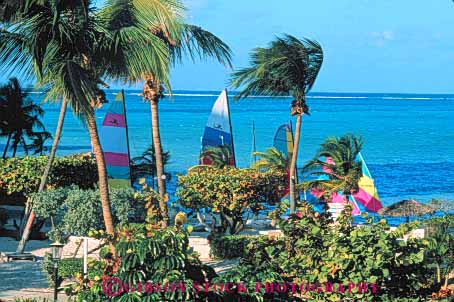 Stock Photo #10240: keywords -  bahamas beach boat caribbean destination destinations horz nassau ocean palm resort resorts sailboats sea sunny sunshine travel tree trees tropic tropical vacation warm water