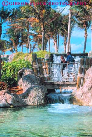 Stock Photo #10245: keywords - atlantis bahamas bridge caribbean couple destination destinations island islands lagoon nassau ocean paradise people pool resort resorts rope sea sunny sunshine travel tropic tropical vacation vert walkway warm waterfall