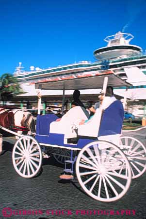 Stock Photo #10268: keywords -  bahamas caribbean carriage carriages destination destinations horse horses island islands motion nassau port resorts rotate rotates rotating rotation round spoke spokes sunny sunshine tour tours travel tropic tropical vacation vert warm wheel wheels
