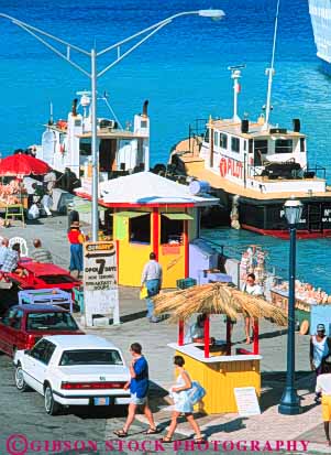 Stock Photo #10270: keywords -  bahamas caribbean destination destinations island islands nassau ocean pedestrian pedestrians people resorts sea sunny sunshine tourist tourists travel traveler travelers tropic tropical vacation vendor vendors vert walk walking warm waterfront