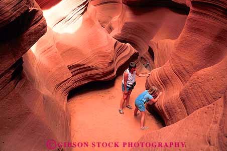 Stock Photo #12798: keywords -  adventure antelope arizona canyon canyons child climb climbing daughter deep deposit deposition erode eroded erodes eroding erosion explore exploring formation formations geologic geological geology girl hike hiking horz in layer layered layers mother natural nature outdoor outside page parent red released rock sandstone sculpted sculptures sediment sedimentary single slot southwest steep strata stratum summer walk walking wall walls warm woman
