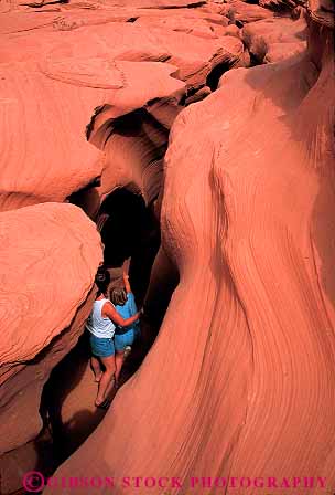 Stock Photo #12799: keywords -  adventure antelope arizona canyon canyons child climb climbing daughter deep deposit deposition erode eroded erodes eroding erosion explore exploring formation formations geologic geological geology girl hike hiking in layer layered layers mother natural nature outdoor outside page parent red released rock sandstone sculpted sculptures sediment sedimentary single slot southwest steep strata stratum summer vert walk walking wall walls warm woman